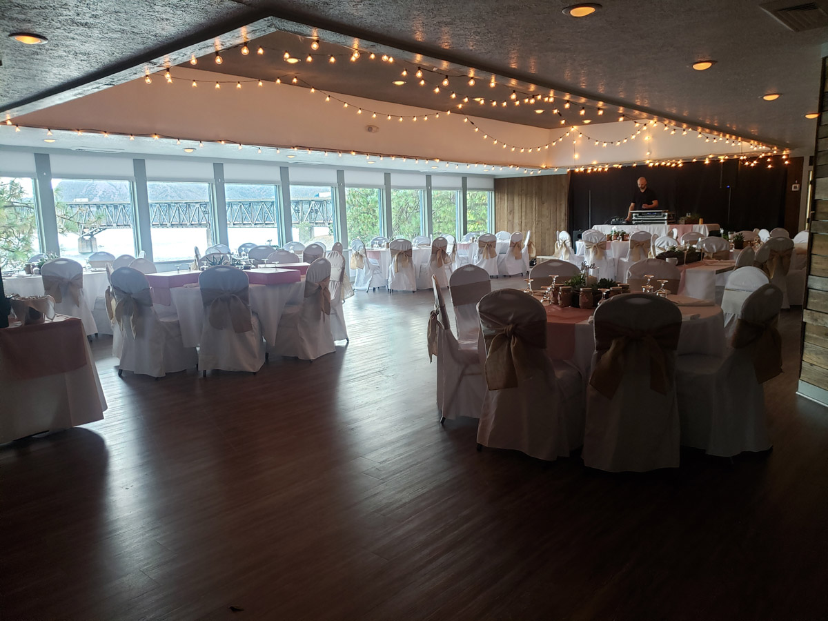 An inviting view of a well-set table with a chair, beautifully arranged and ready for a presentation or gathering.